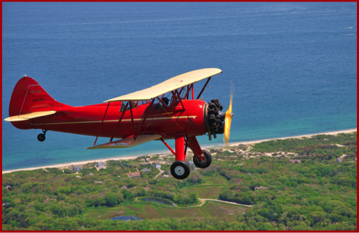 1040's Waco biplane over Cape Cod